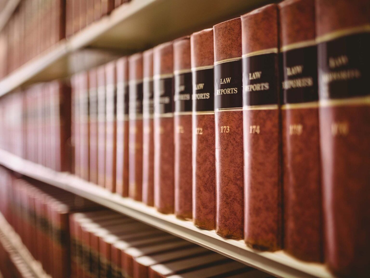 A row of law books on a shelf in a library