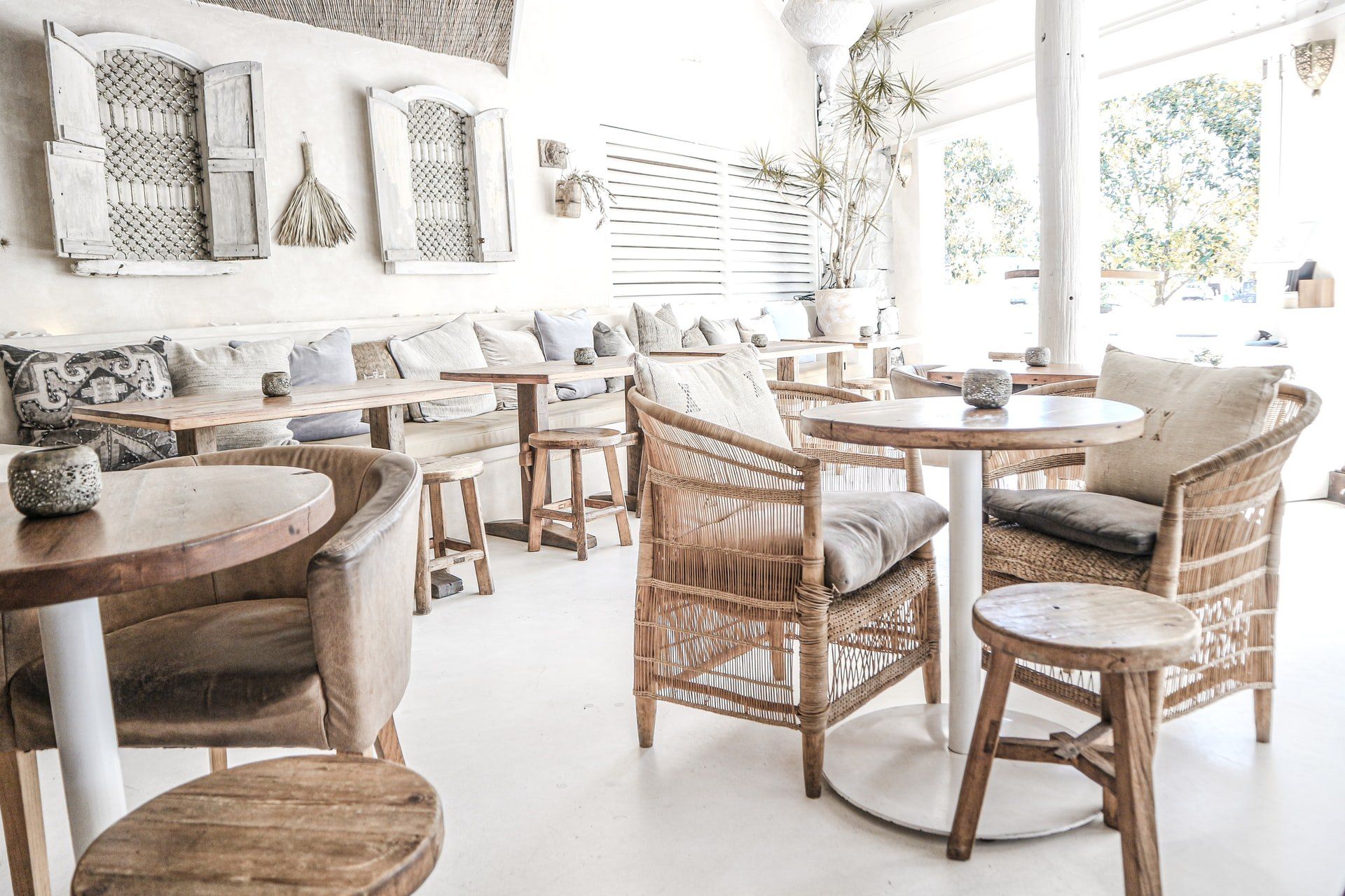 A restaurant with tables and chairs in it.