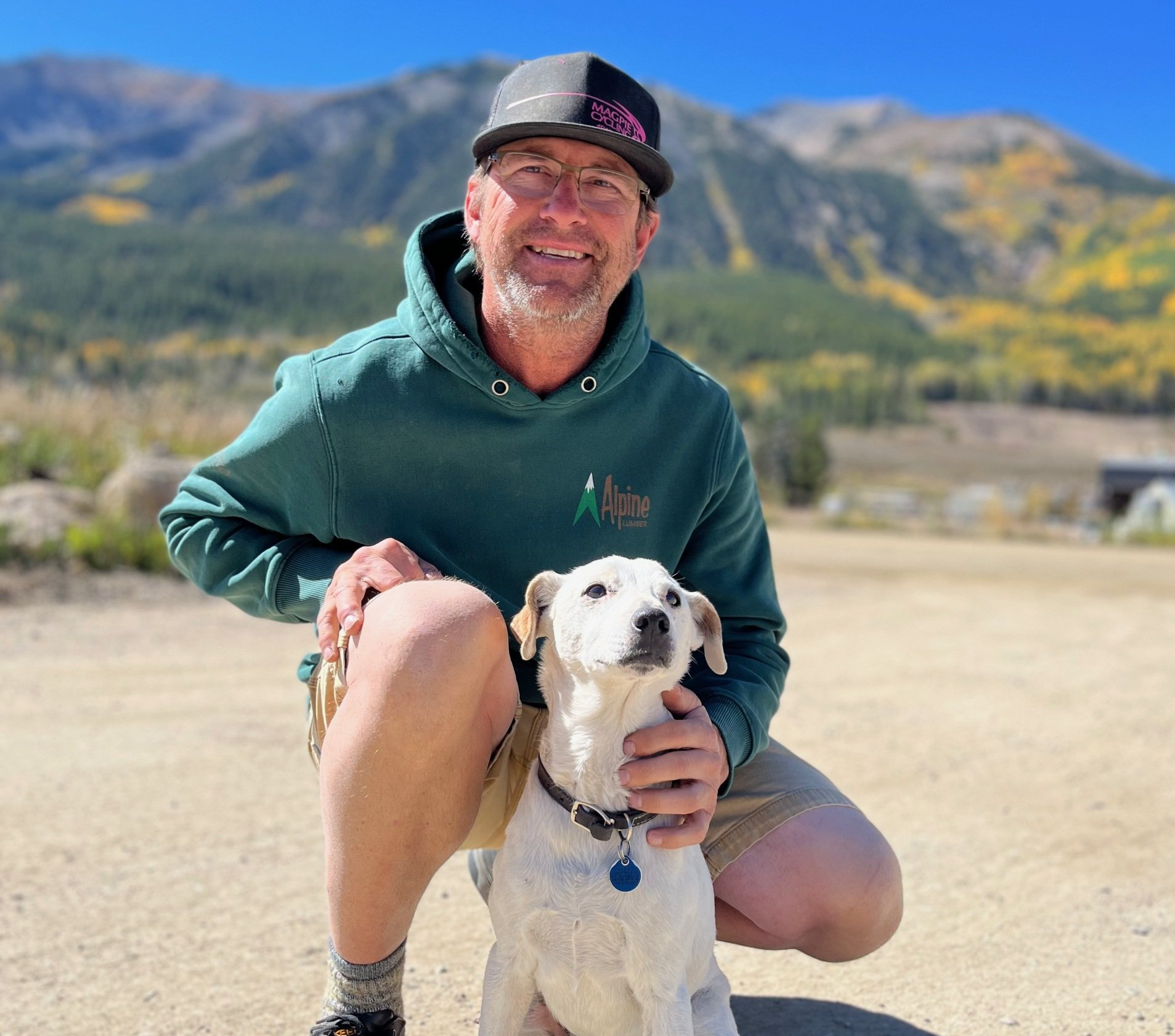 black jack garage door owner greg with dog in front of garage door