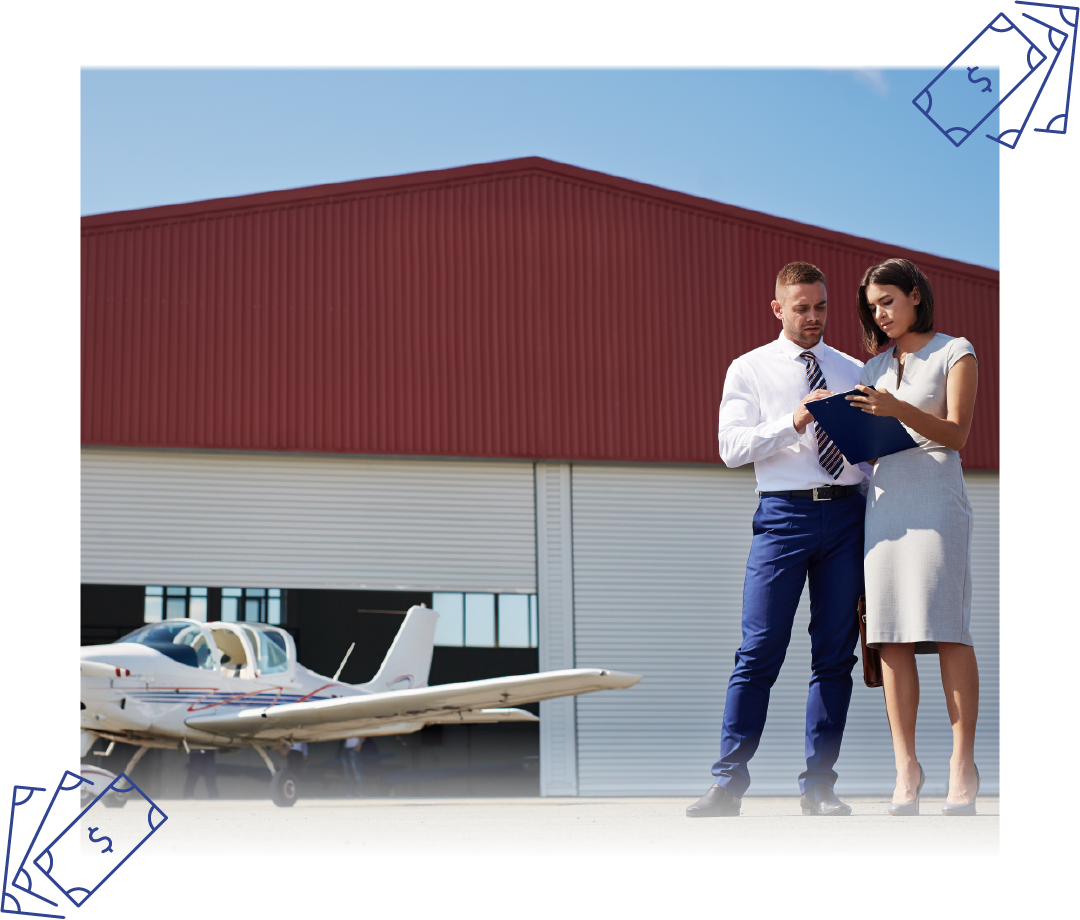 A man and a woman are standing in front of an airplane looking at a clipboard.