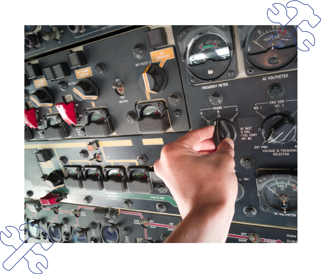 A person is working on a control panel on an airplane.
