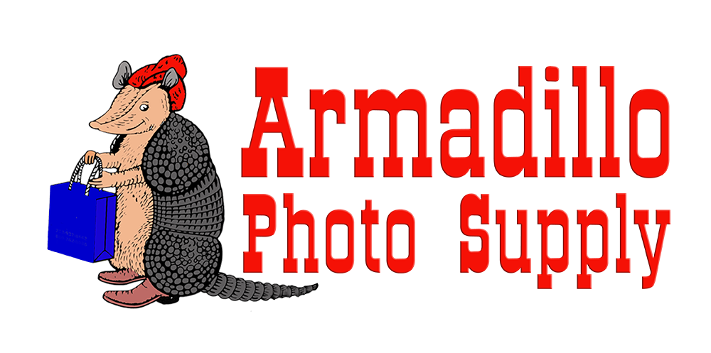 Armadillo Photo Supply logo, illustration of armadillo in a red hat, holding a blue shopping bag