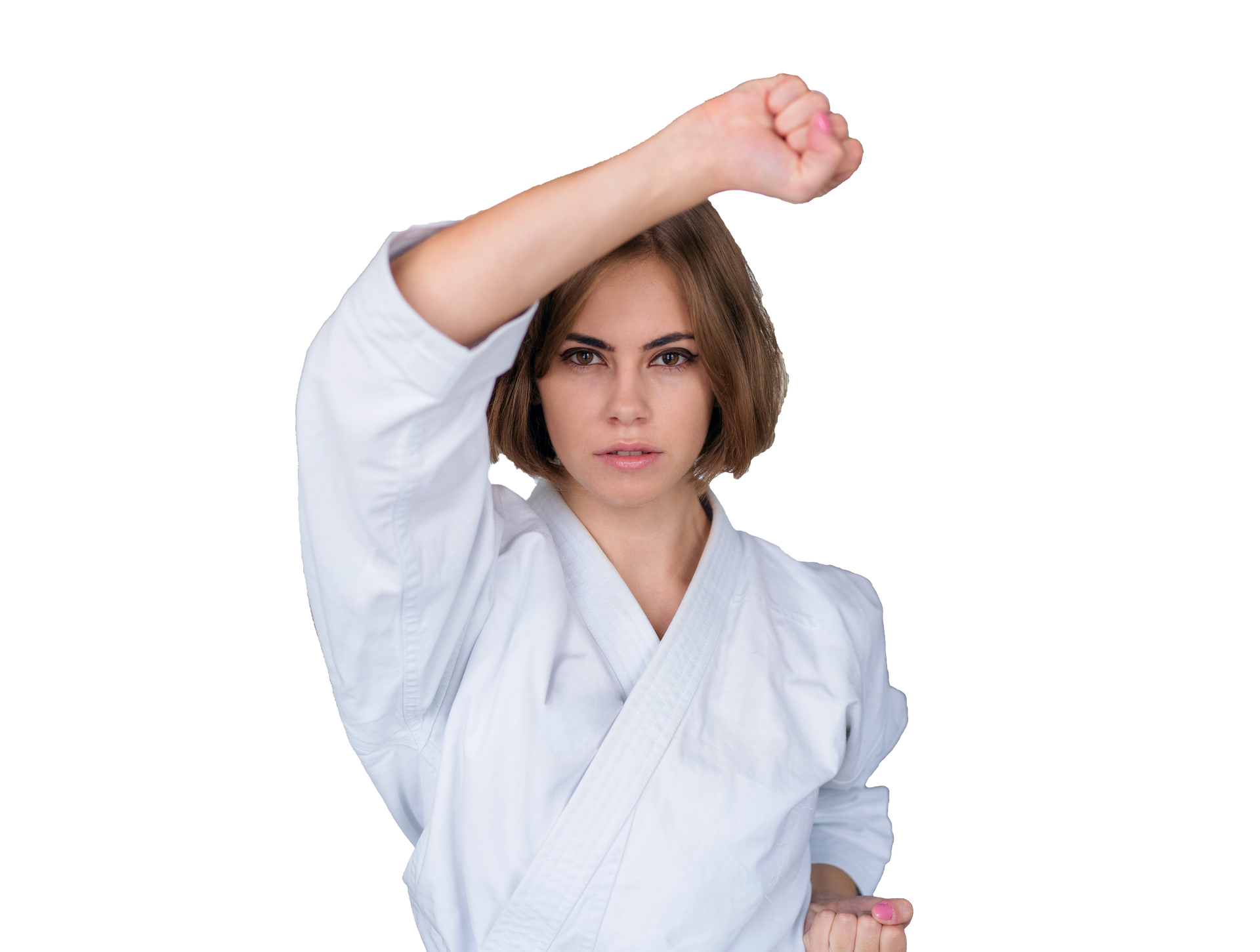 A person in a white karate uniform performing a high rising block with a focused expression against a white background.