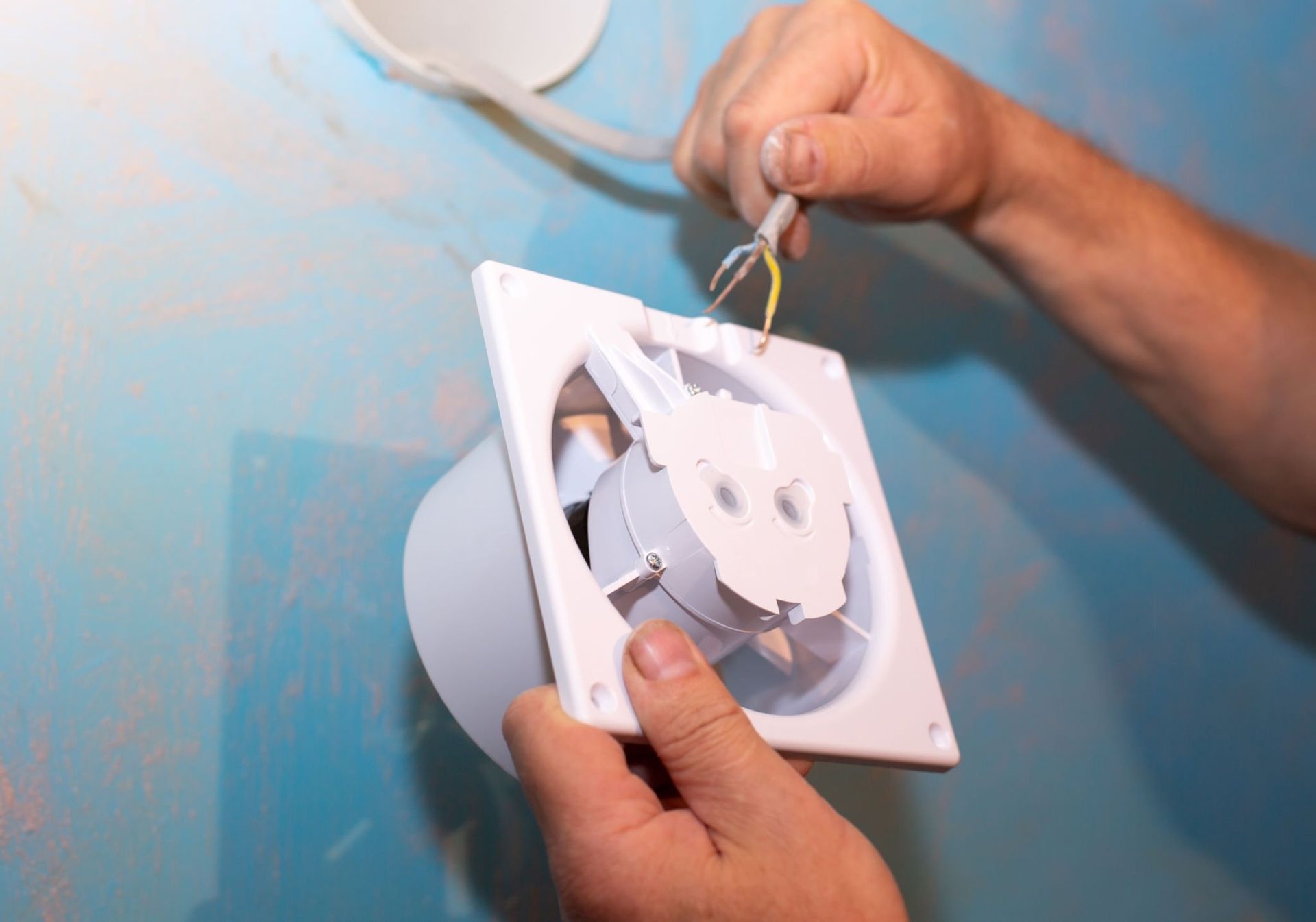 Candudo intalling bathroom fan servicing Michigan
