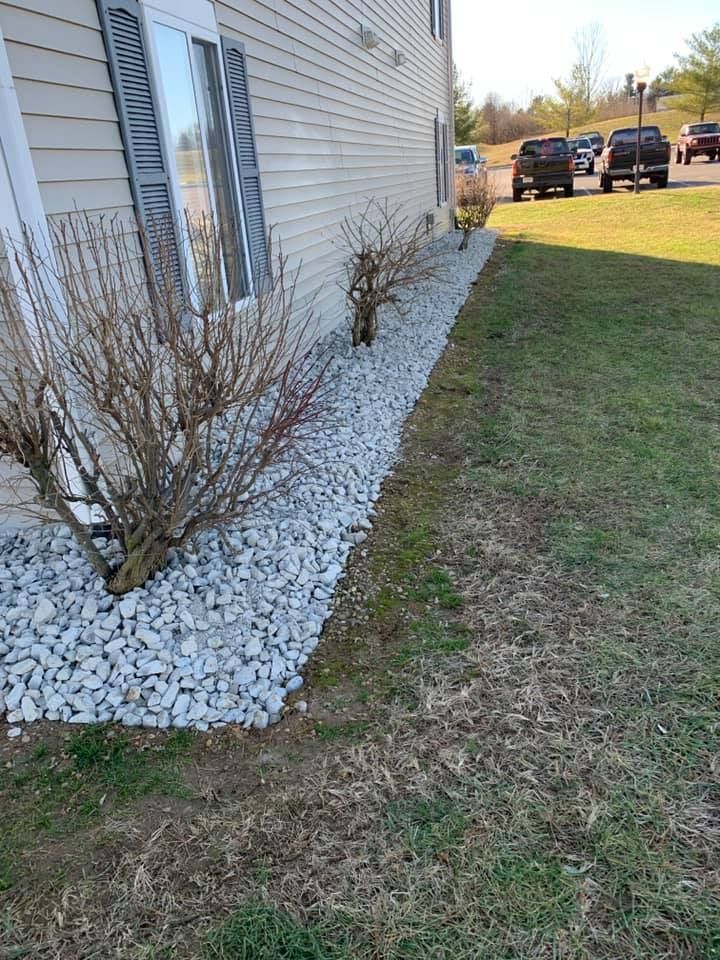 A house with a lot of rocks in front of it.