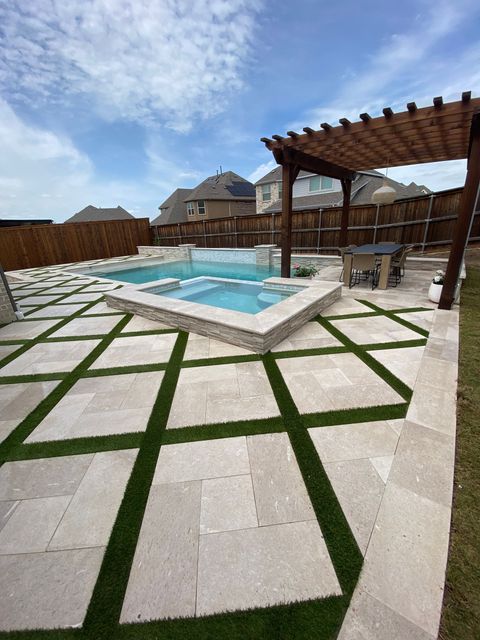 A backyard with a swimming pool and a pergola