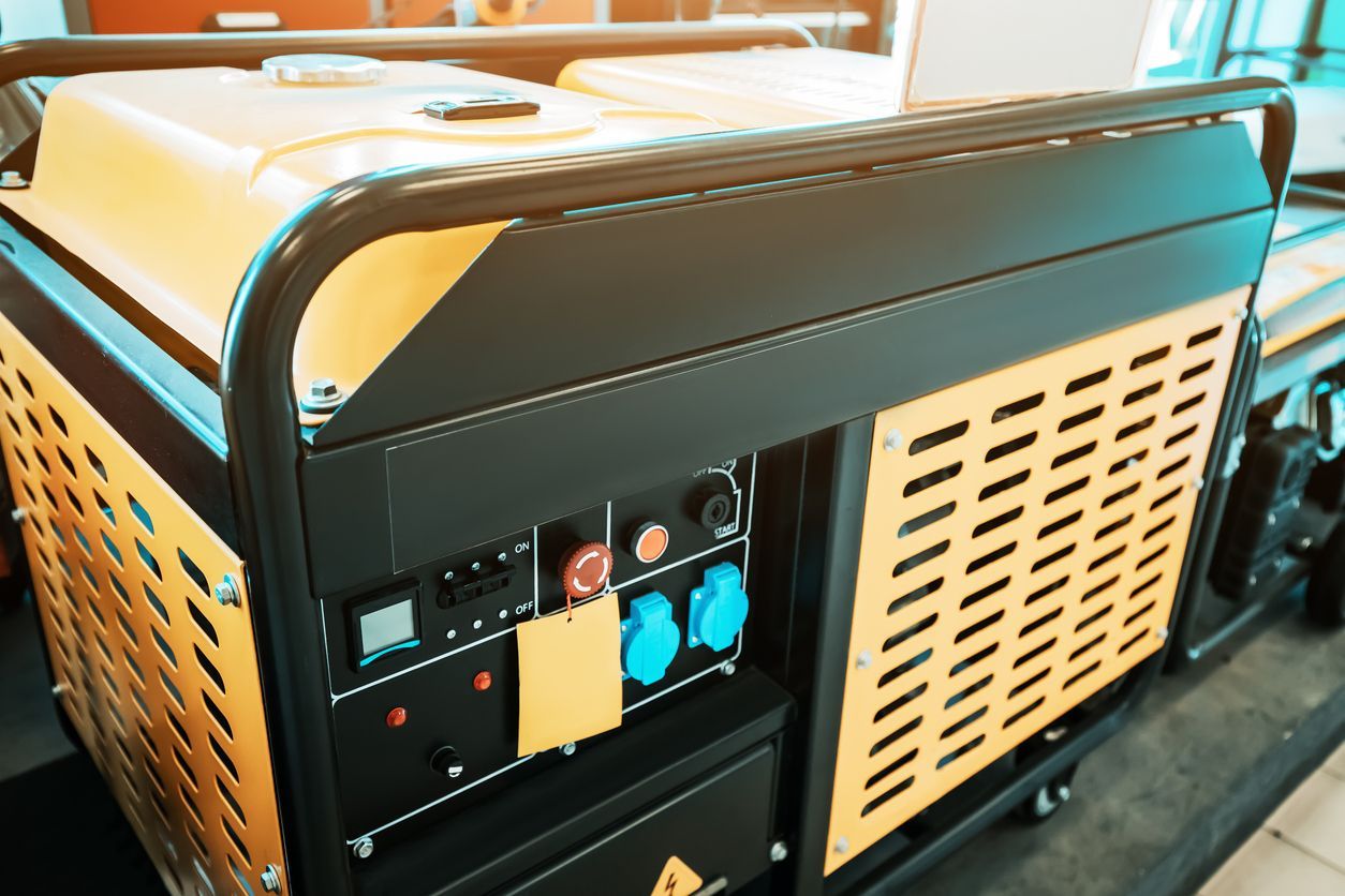 Yellow and black portable generator with control panel and outlets.