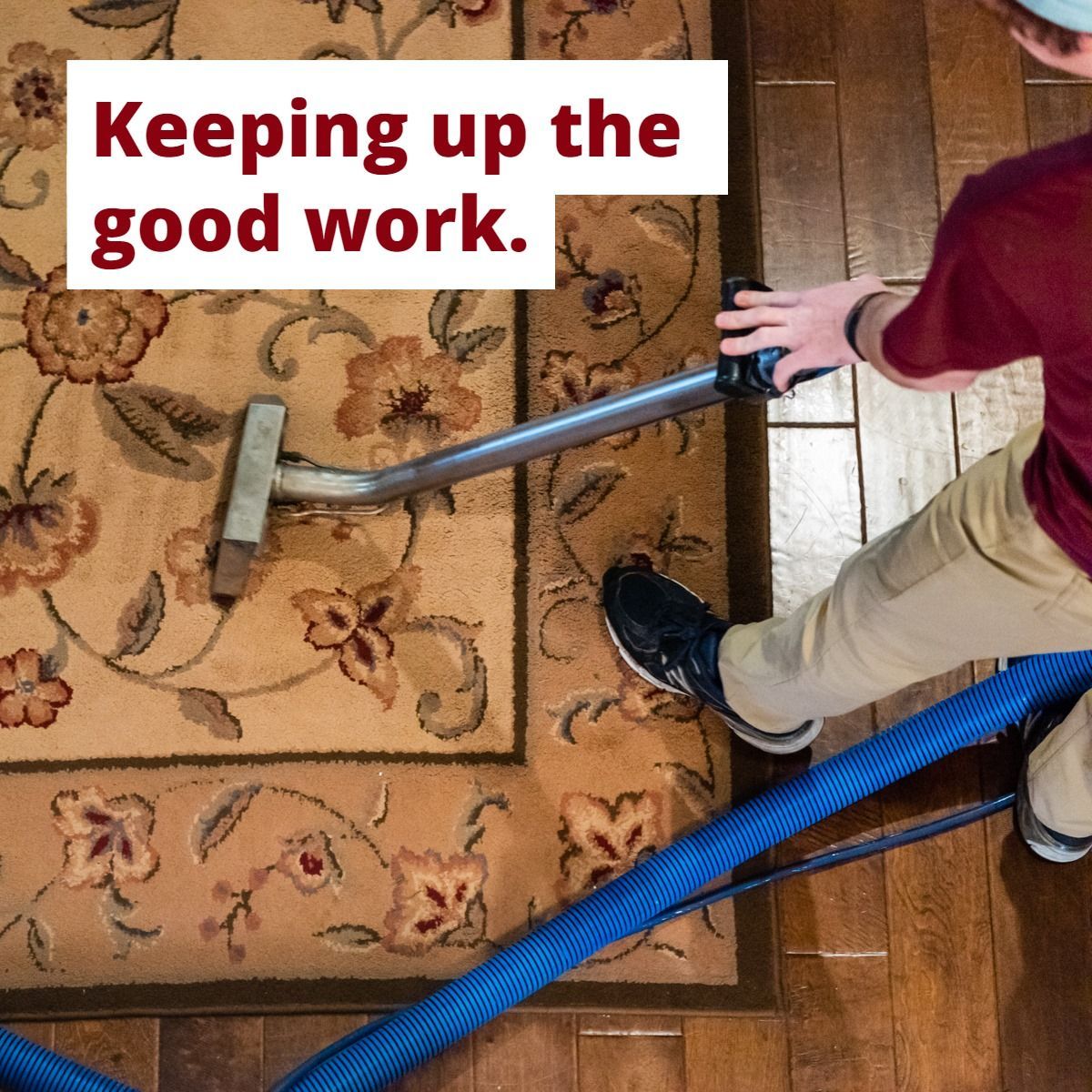 a man is using a vacuum cleaner to clean a rug