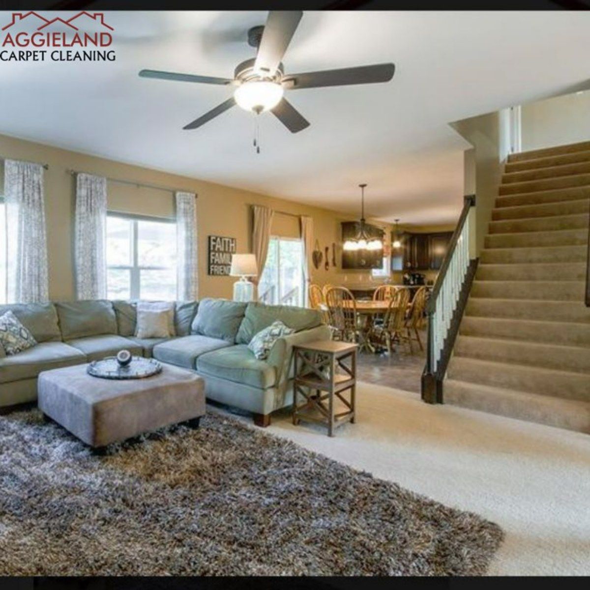a living room with a couch ottoman and a ceiling fan from Aggieland Carpet Cleaning.