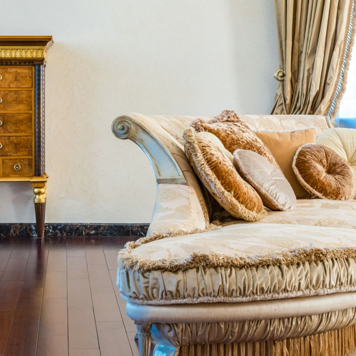 a living room with a couch and a dresser