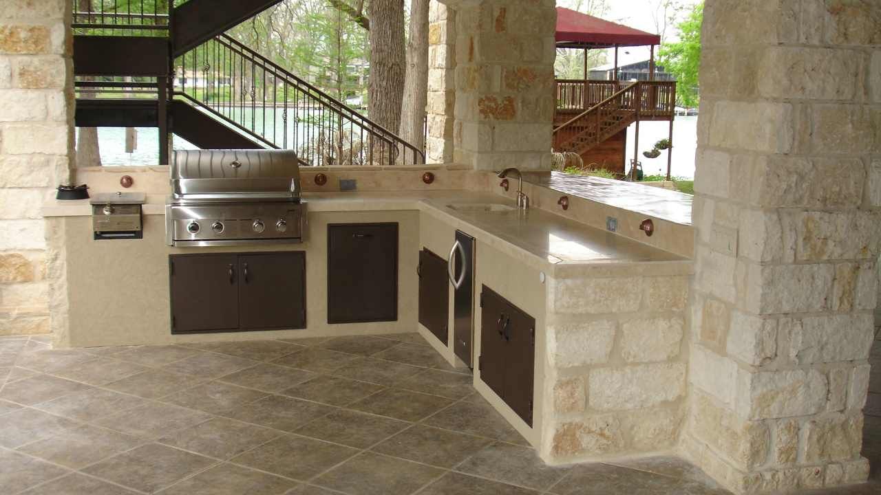 Partially built concrete block wall inside a structure showing careful block and retaining wall layout
