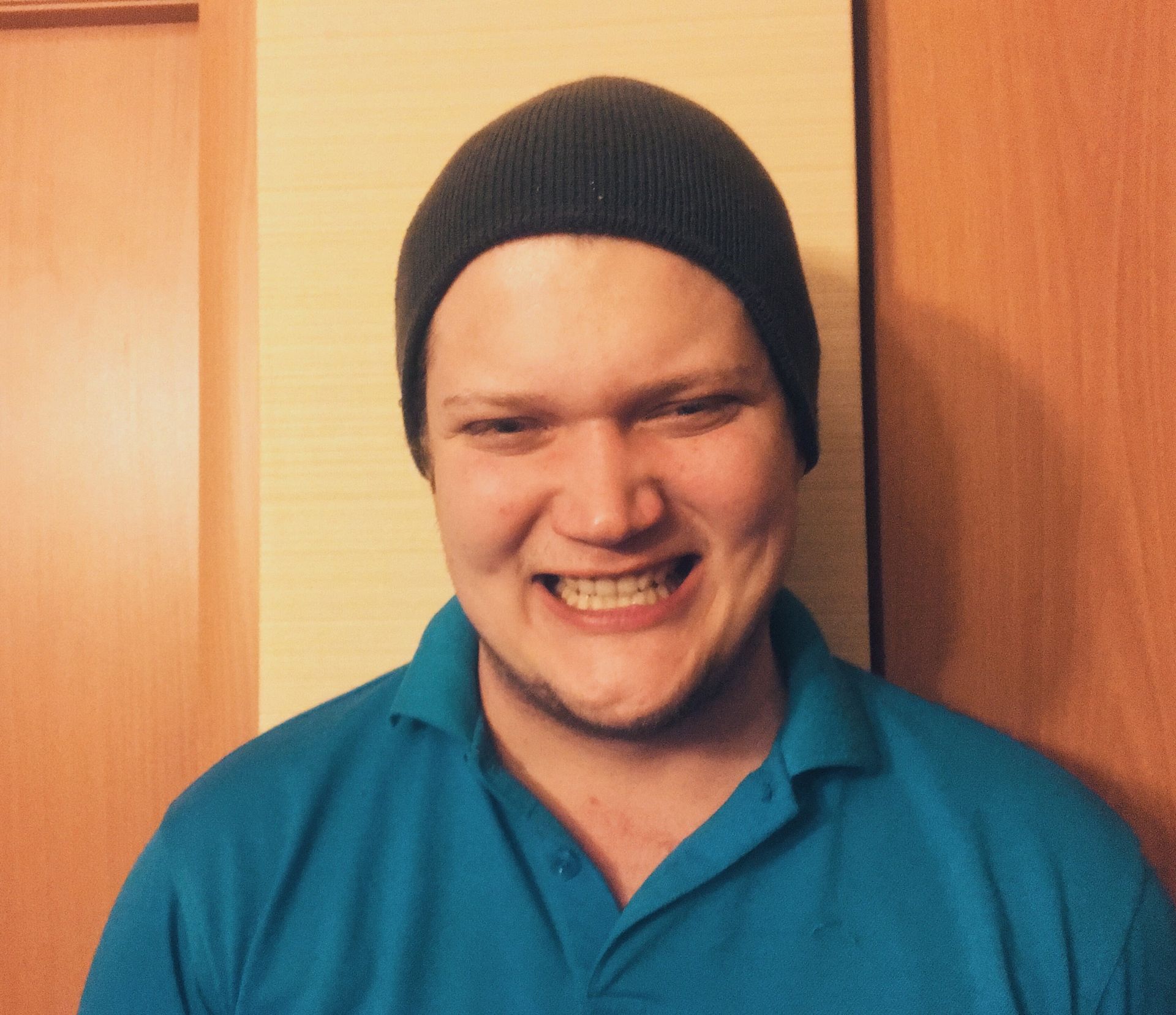 A man doing a goofy smile.