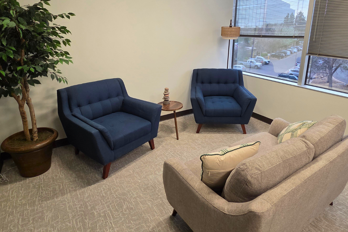 Calming office space with a couch and chairs