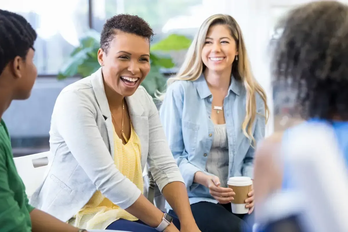 Group of people sitting and having conversation.