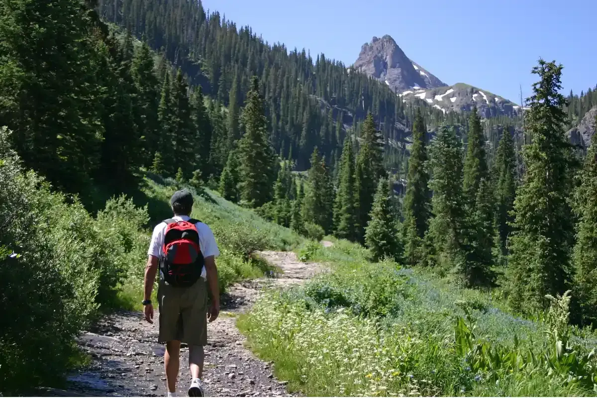 Man hiking through Colorado mountains