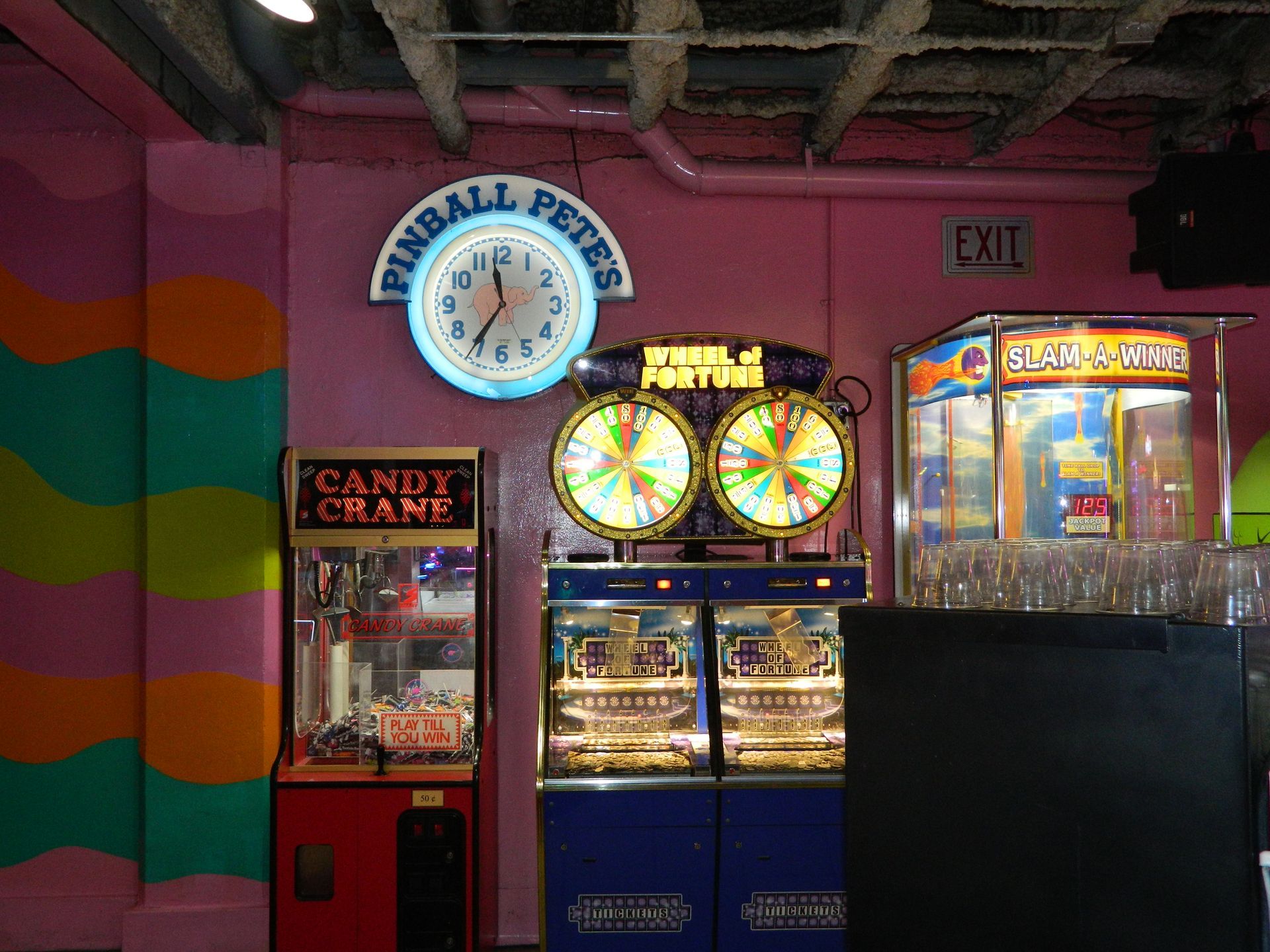 Arcade games in a brightly colored room: 