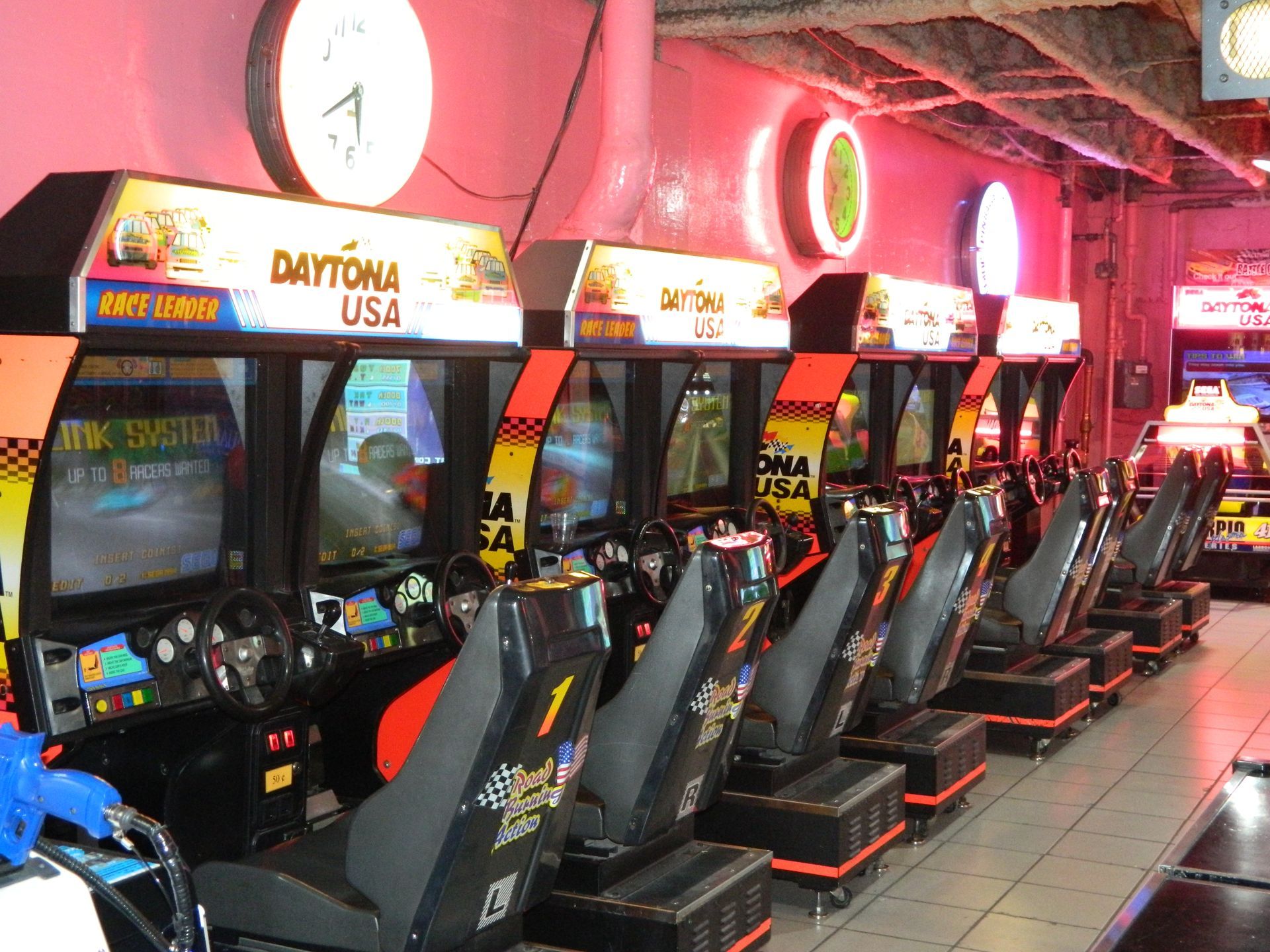 Arcade game concession stand with pink trim, snacks, prizes, and 