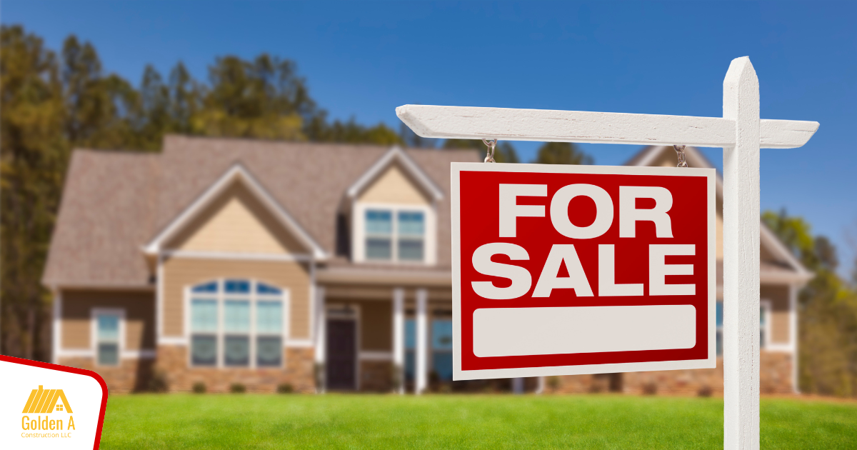 A for sale sign in front of a house