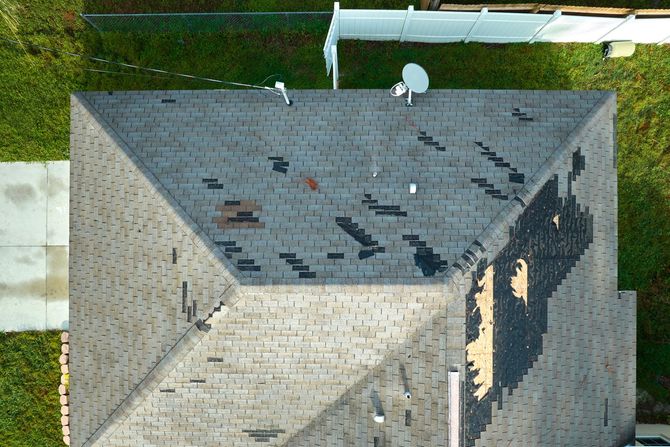 An aerial view of a roof with a satellite dish on it