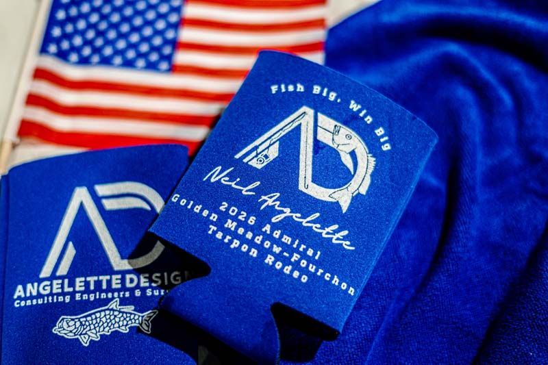 Blue custom apparel tags and shirt with an American flag background