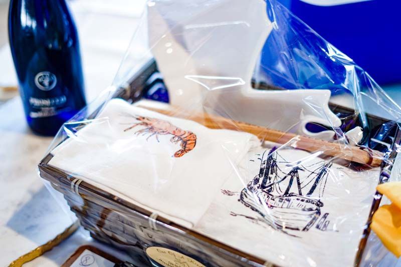Wrapped artwork on a table, with a blue water bottle in the background.
