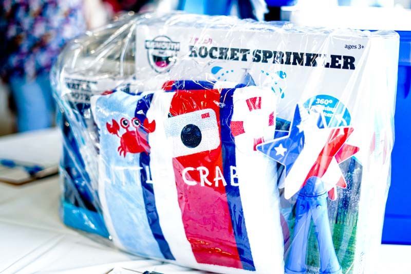 Wrapped Rockets-themed gifts in clear plastic with blue, red, and white packaging