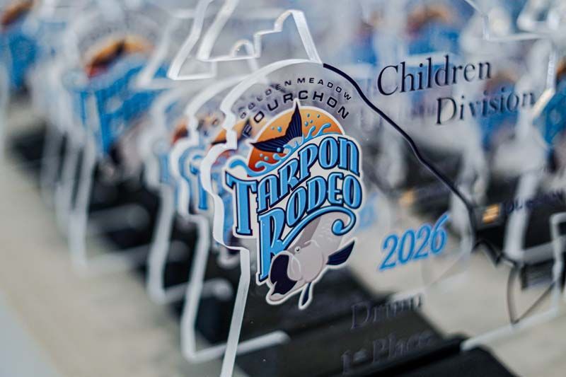 Close-up of Tarpon Ladies Kids 2020 Children Division trophies with blue and silver designs