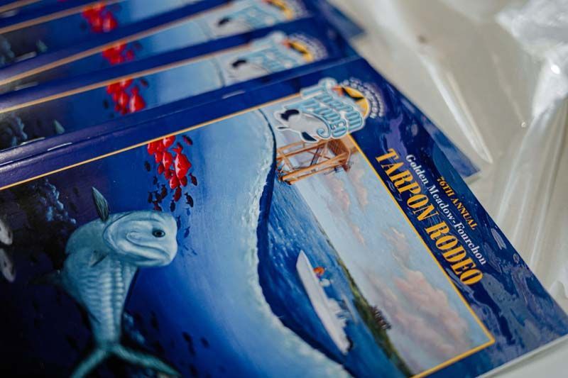 Stack of blue children's books with sea creature illustrations and the title 