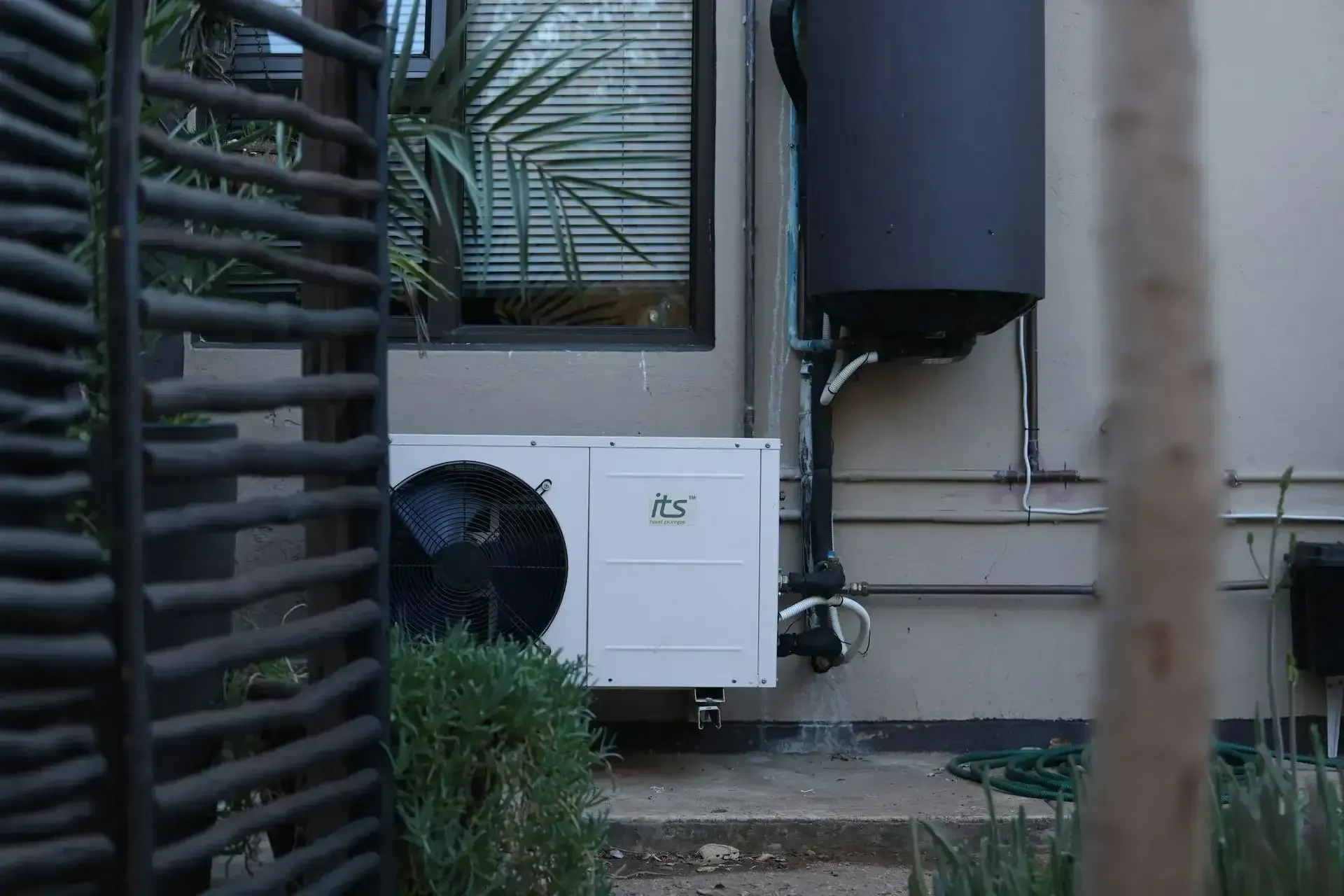 Heat pump unit installed outside home