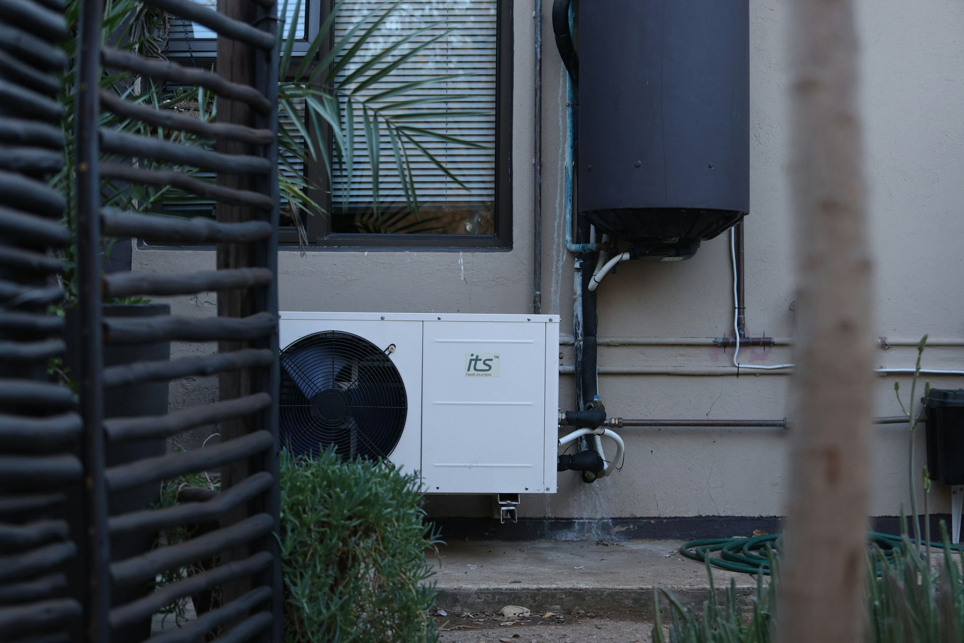Heat pump unit installed outside home