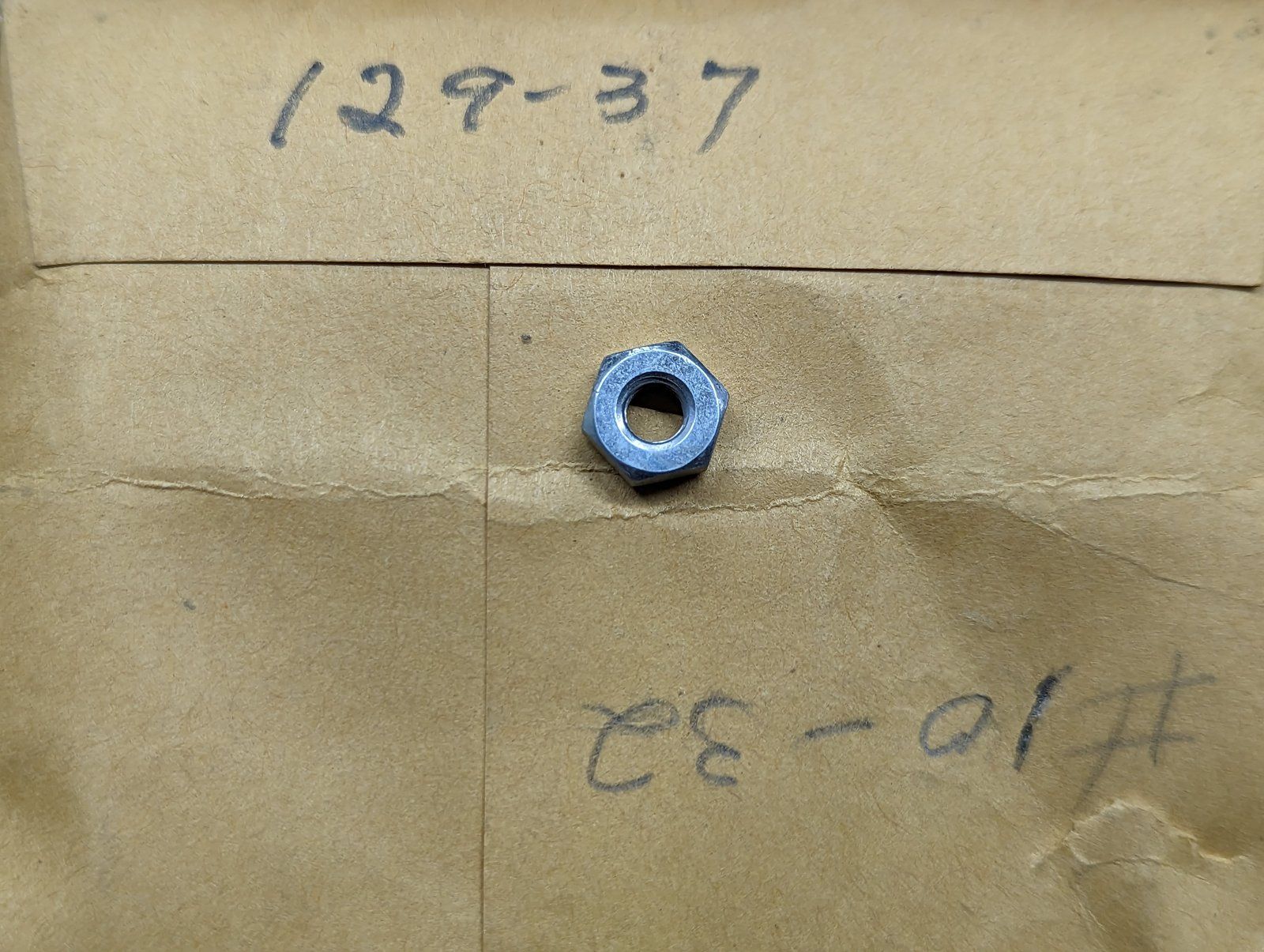 129-37 NUT 10-32 - Ingersoll/Case Tractor Part