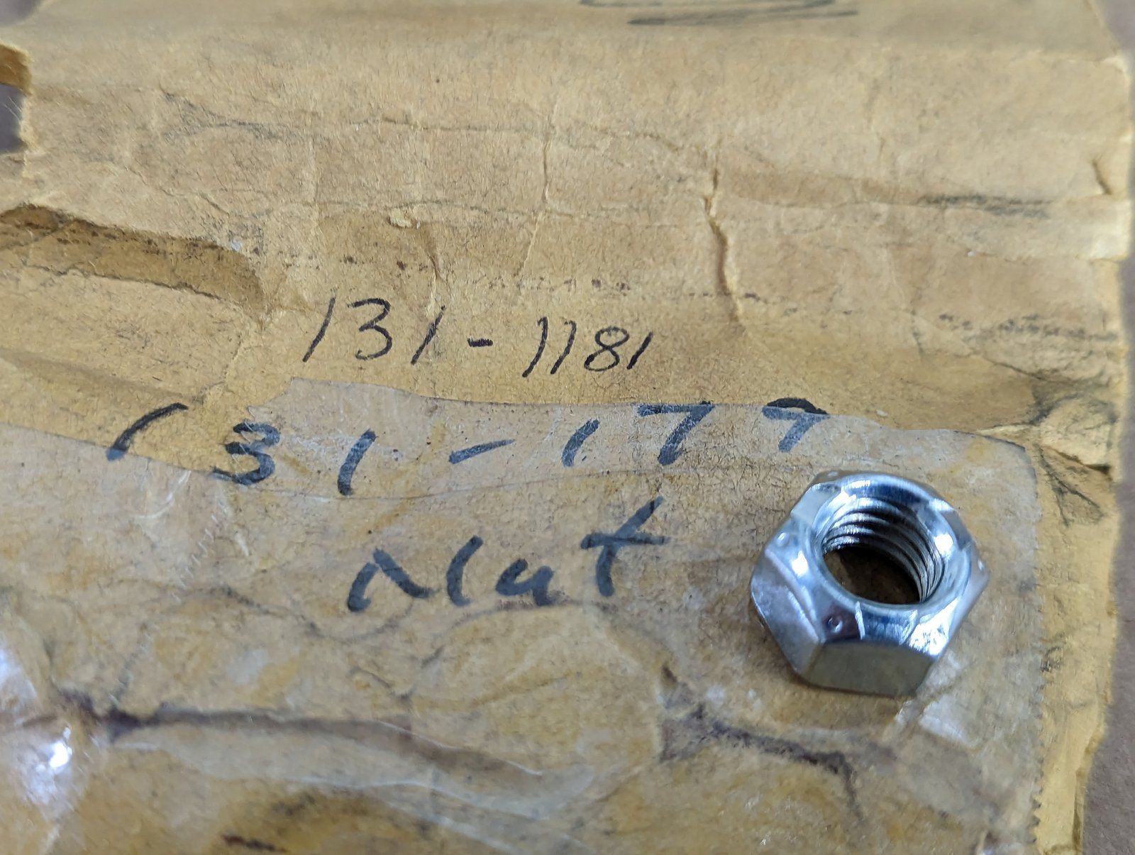 131-179 NUT 3/8-16 HX CTR LK ZP` NUT 3/8-16 LK 131-1181 - Ingersoll/Case Tractor Part