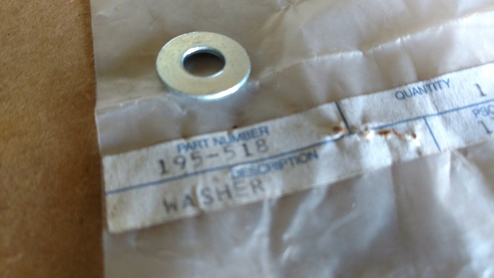 195-518 WASHER .281x.625x.051/.080 ZP 1/4 SAE - Ingersoll/Case Tractor Part