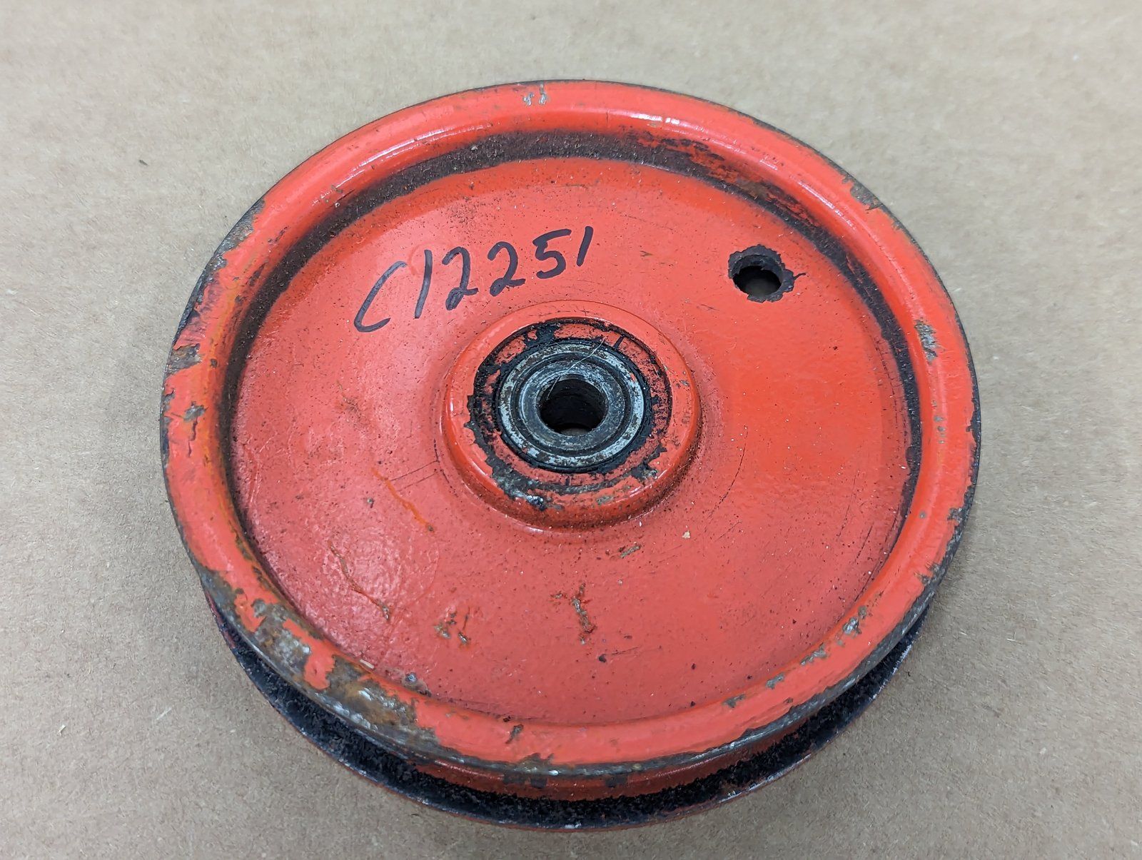 C12251 ( replaces G9021092 ) USED PULLEY-FLAT IDLER 4x.75Wx3/8 - Ingersoll/Case Tractor Part