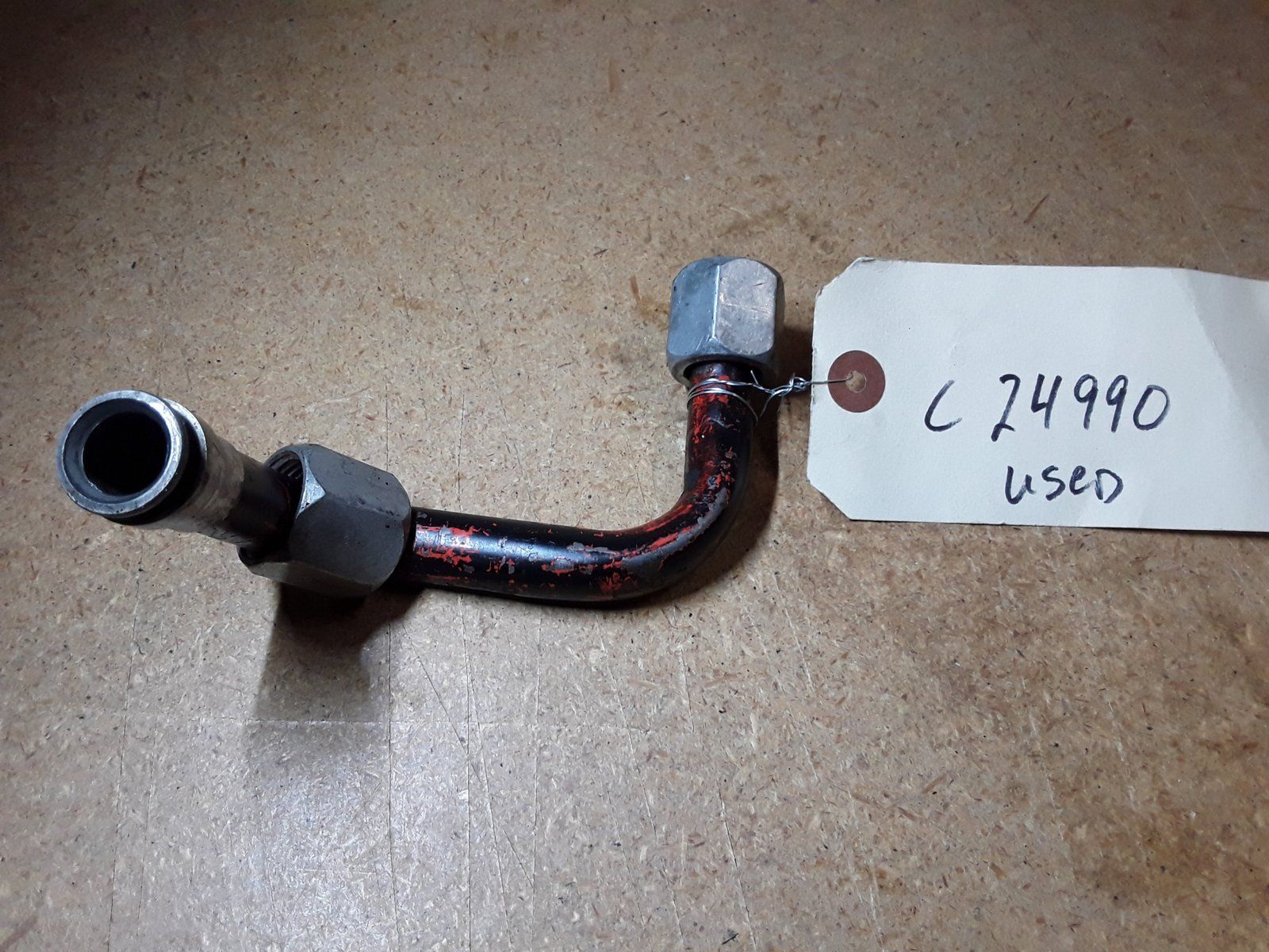 C24990 USED TUBE-HOLDING VALVE TO TRAVEL CONTROL VALVE - Ingersoll/Case Tractor Part