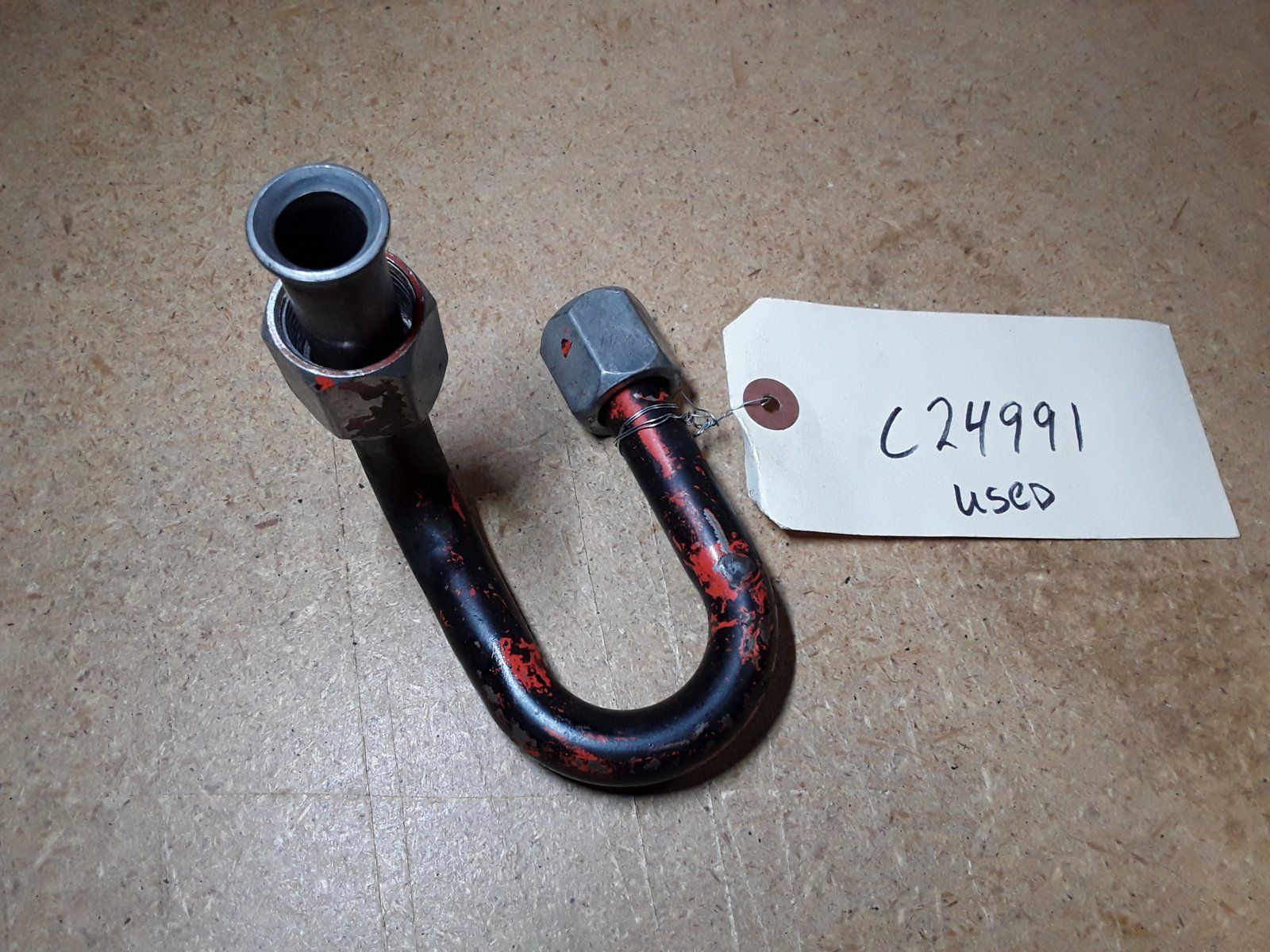 C24991 USED TUBE - HOLDING VALVE TO TRAVEL CONTROL VALVE - Ingersoll/Case Tractor Part