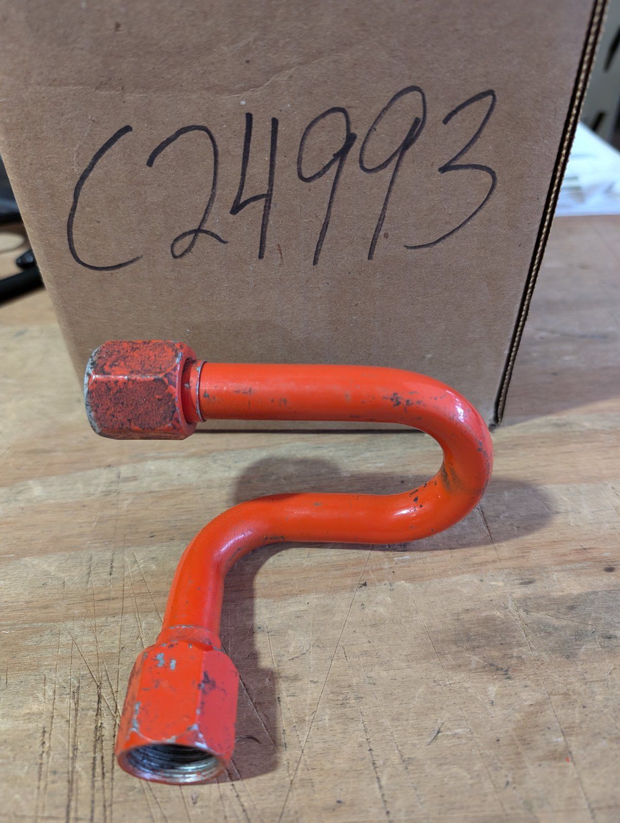 C24993 USED TUBE-HOLDING VALVE TO TRAVEL - Ingersoll/Case Tractor Part