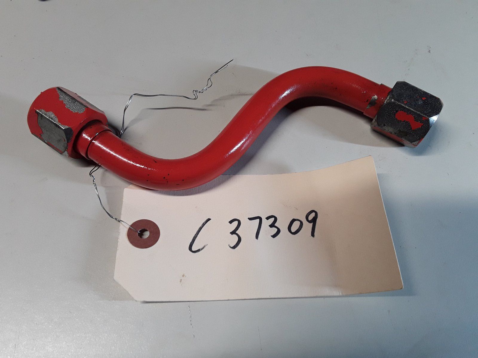 C37309 USED TUBE - VALVE TO MOTOR UPPER - Ingersoll/Case Tractor Part