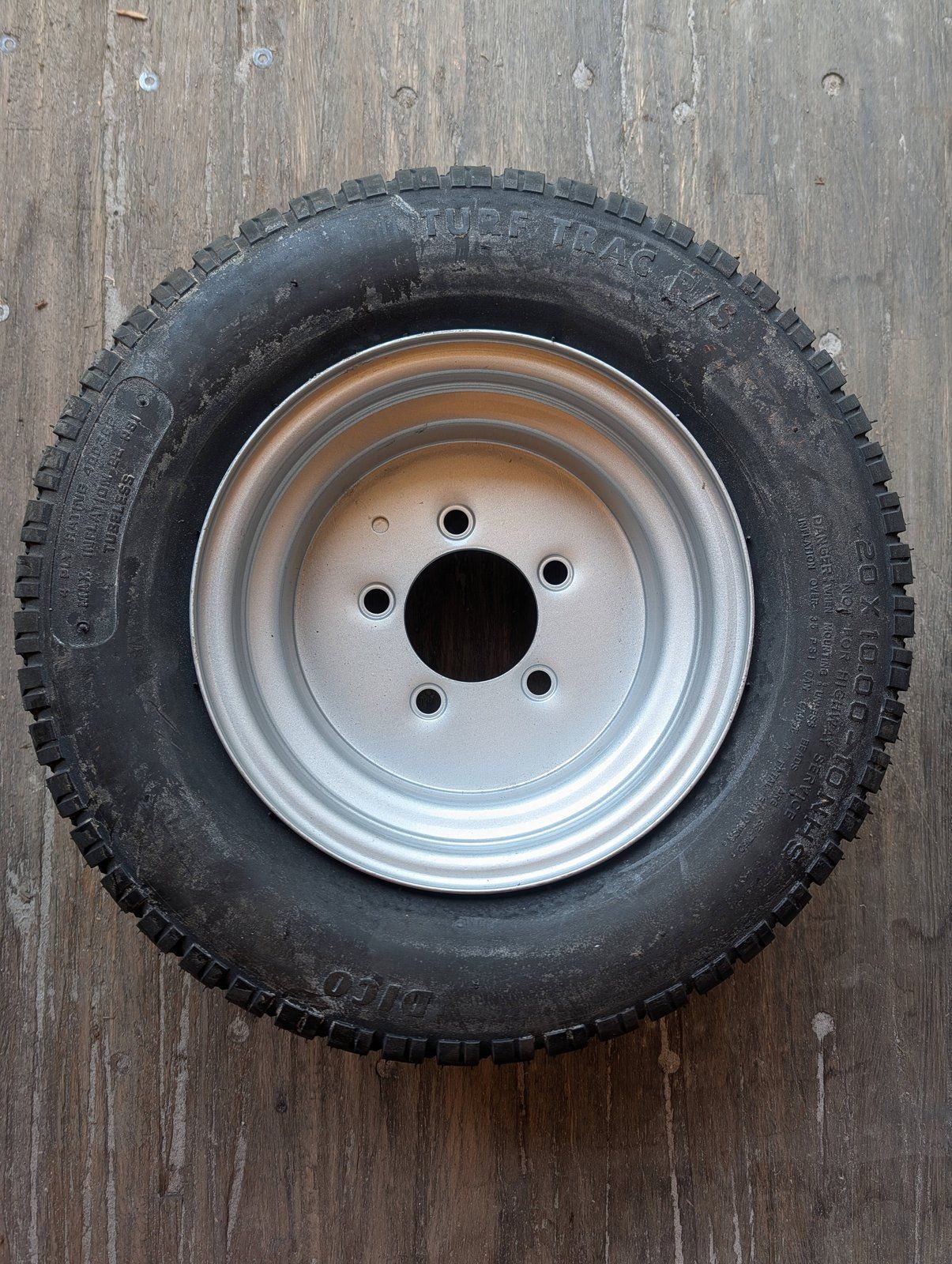 C44849 ( replaces G9021225 ) WHEEL/TIRE 20X10.00-10 ZTR 4 BOLT - Ingersoll/Case Tractor Part