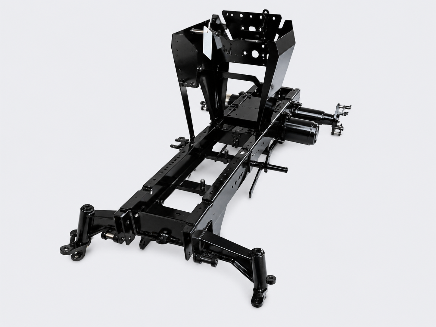 Black metal vehicle chassis frame with suspension and seat mounts on a white background