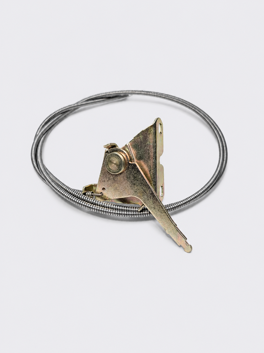 Coiled metal cable with a triangular brass and silver clasp on a white background
