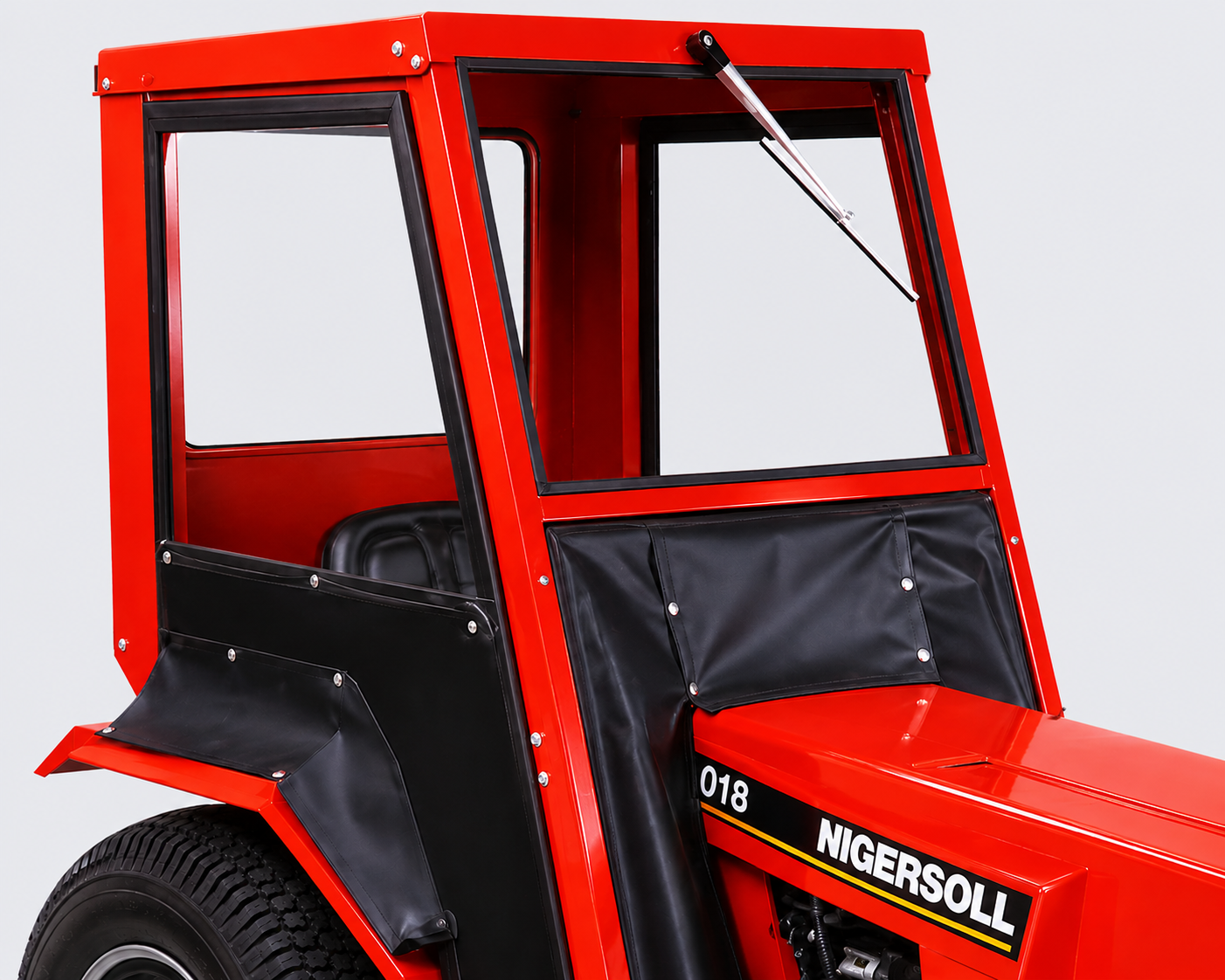 Close-up of a red Ingersoll tractor cab with black trim and clear windows