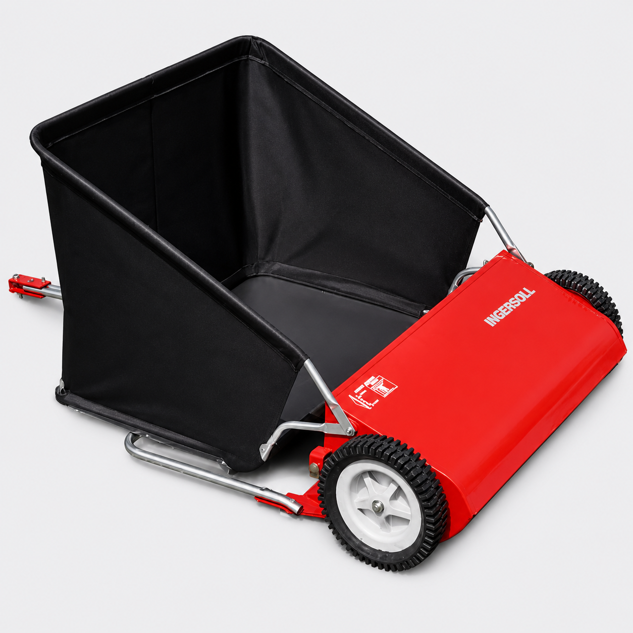 Red push lawn sweeper with black collection hopper and white wheels on a light background