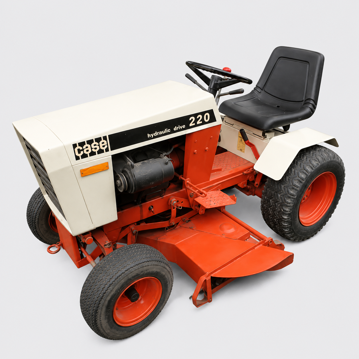 Vintage red and white lawn tractor with black seat, shown at an angle on a white background