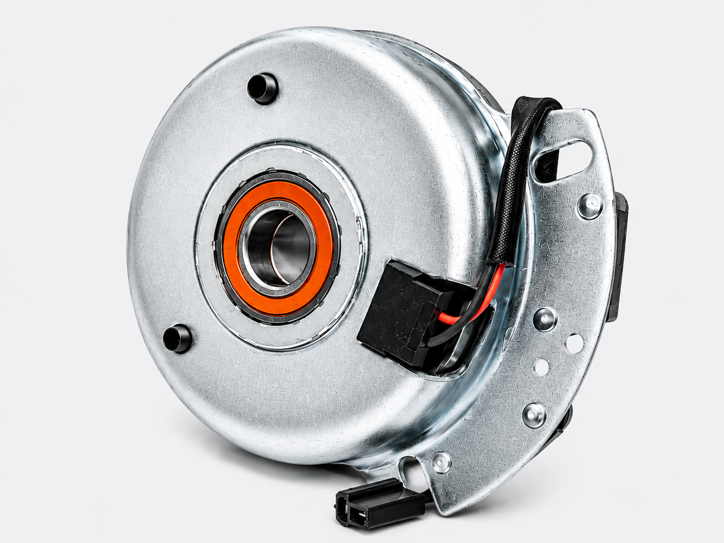 Close-up of a silver electric motor with exposed wiring and a black mounting bracket