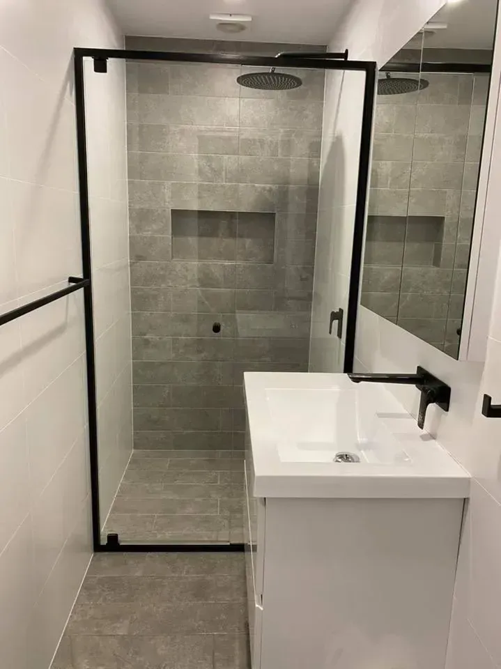 Modern Bathroom With a Walk-in Shower — Jamac Cleaning Services in Cardiff, NSW