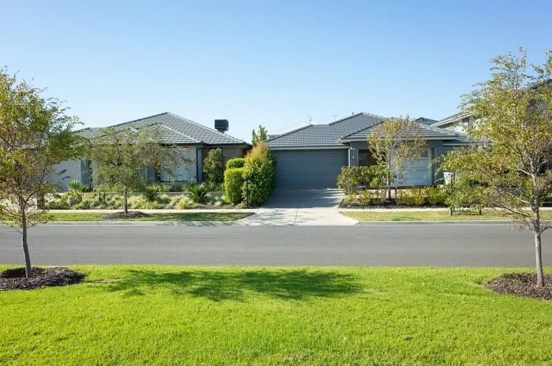 Suburban House With a Two-car Garage — Jamac Cleaning Services in Cameron Park, NSW