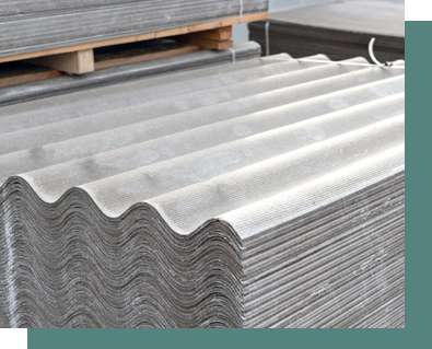 A stack of corrugated roofing sheets sitting on top of each other on a wooden pallet.