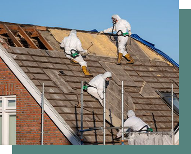 A group of people are working on the roof of a house.