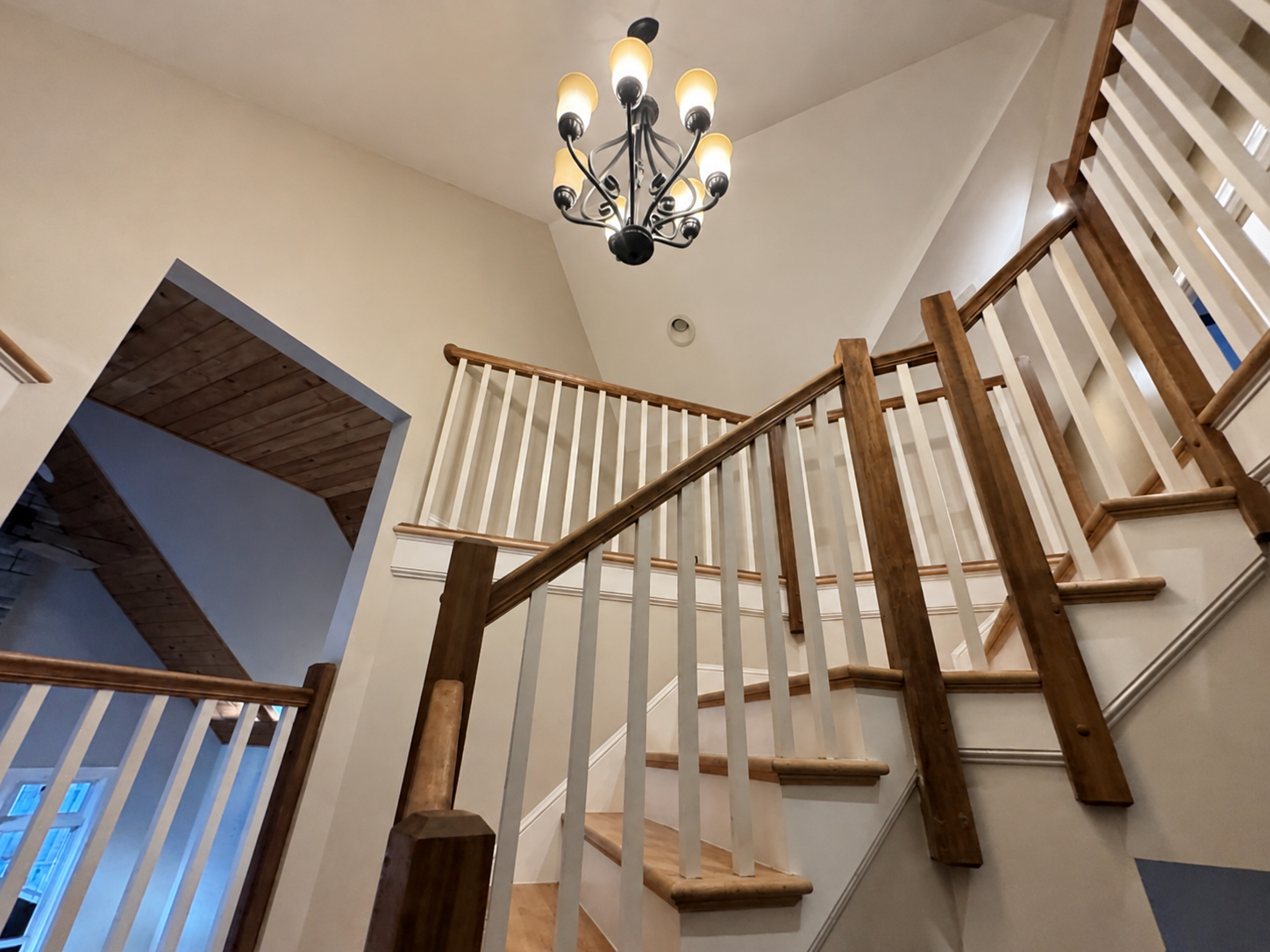 Freshly painted staircase walls and trim by PTG Painting in Norton, Massachusetts